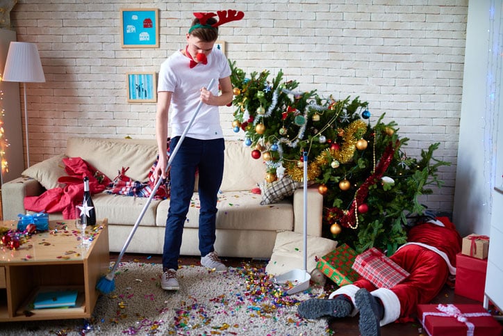 MAn Sweeping Up Christmas Party