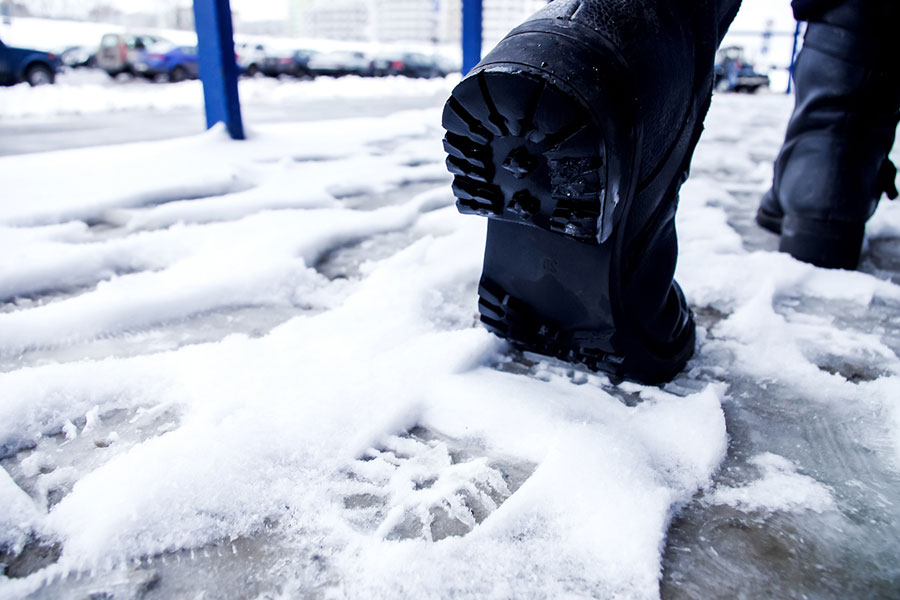 Black Boots Walking in Snow